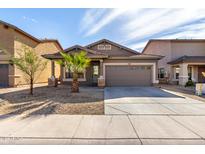 Charming single story home with a well-maintained front yard and two-car garage at 3129 W Fremont Rd, Phoenix, AZ 85041