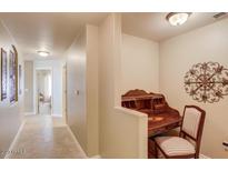 A bright hallway with built-in desk and access to other rooms at 5350 E Deer Valley Dr # 4248, Phoenix, AZ 85054