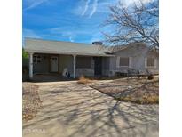 Ranch style home with carport and mature trees at 6609 N 20Th Ave, Phoenix, AZ 85015