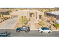 Stunning single-Gathering home showcasing a desert landscape and neutral earth-tone stucco exterior at 8606 S 30Th St, Phoenix, AZ 85042