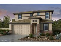 Two-story house with beige siding, brown brick accents, and a two-car garage at 9054 S 169Th Dr, Goodyear, AZ 85338