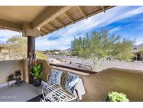 Relaxing balcony with city views and comfortable seating at 9100 E Raintree Dr # 232, Scottsdale, AZ 85260