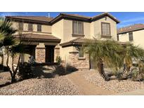 Two-story house with stone accents and landscaping at 11340 E Stearn Ave, Mesa, AZ 85212