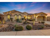 Beautiful single-story home with desert landscaping and a three-car garage at 18125 W Acacia Dr, Goodyear, AZ 85338