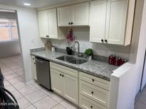 Modern kitchen with granite countertops and stainless steel appliances at 7126 N 19Th Ave # 161, Phoenix, AZ 85021