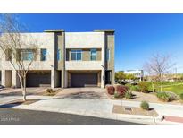 Modern 2-story townhome with attached garage and landscaped yard at 1950 W Desert Hollow Dr, Phoenix, AZ 85085