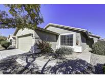 Single-story home with a two-car garage and landscaped front yard at 2234 E 37Th Ave, Apache Junction, AZ 85119