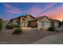 Charming single-story home with a two-car garage, neutral colors, and low-maintenance landscaping at 2234 E Stephens Rd, Gilbert, AZ 85296