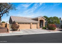 Charming single-story home with a well-manicured front yard and a three-car garage at 1626 E Kathleen Rd, Phoenix, AZ 85022
