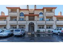 Charming condo exterior showcasing architectural details and convenient parking at 10410 N Cave Creek Rd # 1050, Phoenix, AZ 85020