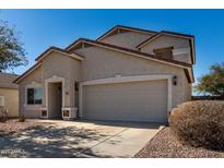 This single Gathering home boasts desert landscaping, a two car garage, and neutral paint at 1370 S 228Th Ln, Buckeye, AZ 85326