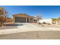 Charming single-story home with a two-car garage and low-maintenance desert landscaping at 36578 N Tatonga Trl, San Tan Valley, AZ 85140