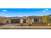 Charming home featuring well-maintained landscaping, a paved driveway, and a two-car garage at 3882 E Andalusia Ave, Gilbert, AZ 85298