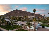 Aerial view of a single-story home with mountain views and palm trees at 6302 E Hillcrest Blvd, Scottsdale, AZ 85251