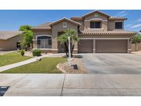 Two-story home featuring desert landscaping, a tile roof, and a two-car garage at 8534 W Salter Dr, Peoria, AZ 85382