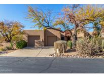 Charming home with a two-car garage and desert landscaping in a sunny neighborhood at 9200 E Whitethorn Cir # 601, Scottsdale, AZ 85266