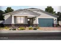 Charming single-story home featuring stone accents, desert landscaping, and a two-car garage at 17624 W Pierson St, Goodyear, AZ 85395