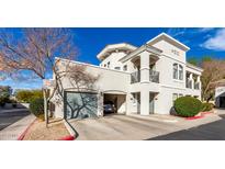 Elegant stucco home with a private garage and balcony offers modern living and beautiful architectural details at 295 N Rural Rd # 259, Chandler, AZ 85226
