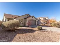 Charming single-story home with a low-maintenance front yard and attached two-car garage at 4799 E Meadow Lark Way, San Tan Valley, AZ 85140