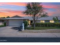 Charming single-story home with a well-manicured lawn and attached garage, perfect for suburban living at 12814 W Shadow Hills Dr, Sun City West, AZ 85375