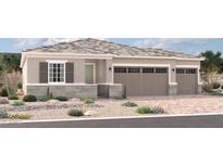 Charming single-story home featuring a neutral color palette, multi-car garage, and desert landscaping at 18193 W Hilton Ave, Goodyear, AZ 85338