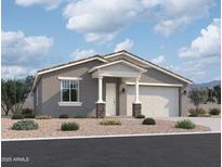 Charming single-story home with stucco siding, a two-car garage, and a desert-landscaped front yard at 9521 W Luxton Ln, Tolleson, AZ 85353