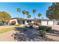 Charming single-story home with desert landscaping, palm trees, and brick accents at 9821 N 29Th Pl, Phoenix, AZ 85028