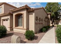 Charming single-story home with stucco exterior, tiled roof, and well-maintained landscaping at 2600 E Springfield Pl # 61, Chandler, AZ 85286