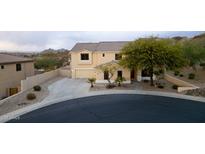 Charming two-story home with a three-car garage and well-manicured front yard landscape at 6206 W Buckhorn Trl, Phoenix, AZ 85083