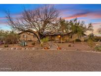 Charming single-story home with desert landscaping and a stone walkway leading to the front door at 10718 E Fenimore Rd, Mesa, AZ 85207