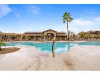 Gorgeous community pool with palm trees and luxurious lounge area, perfect for soaking up the sun at 11500 E Cochise Dr # 2067, Scottsdale, AZ 85259