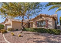 Charming single-story home featuring desert landscaping and a tile roof at 17816 W Mariposa Dr, Surprise, AZ 85374