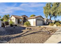 Charming single-Gathering home with tile roof, desert landscaping and attached two car garage at 4327 E Walnut Rd, Gilbert, AZ 85298
