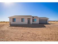 Charming single-story home featuring stucco siding, a gray roof, and a two-car garage at 43894 W Reitz Ranch Rd, Maricopa, AZ 85138