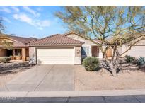 Charming single-story home featuring a well-maintained front yard, desert landscaping and a two-car garage at 4744 E Laredo Ln, Cave Creek, AZ 85331