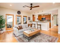 Inviting living room boasts an open floor plan, modern furnishings, and seamless access to outdoor spaces at 231 W Portland St, Phoenix, AZ 85003