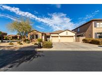 Charming single-story home featuring a three-car garage and desert landscaping at 2422 W Aloe Vera Dr, Phoenix, AZ 85085