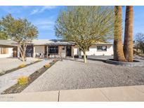 Charming single-story home featuring manicured landscaping, stone accents and a welcoming entrance at 3803 S Elm St, Tempe, AZ 85282