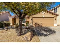 Charming single-story home with a well-manicured yard and a two-car garage at 4040 E Rowel Rd, Phoenix, AZ 85050