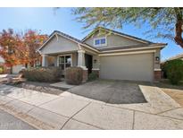 Charming single-story home with a well-manicured lawn, two-car garage, and classic desert landscaping at 7924 S 24Th Pl, Phoenix, AZ 85042