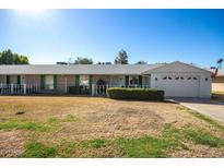 Charming single-story home showcasing its well-maintained yard and attached garage at 10105 W Bolivar Dr, Sun City, AZ 85351