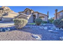 Beautiful two-story home featuring desert landscaping with blue sky in the background at 1349 E Rock Wren Rd, Phoenix, AZ 85048