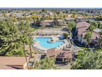 A beautiful aerial view of the community pool, clubhouse, and tennis courts at 1351 N Pleasant Dr # 1031, Chandler, AZ 85225