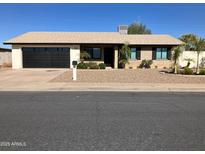 Charming home exterior with a well-manicured yard at 2958 E Contessa St, Mesa, AZ 85213