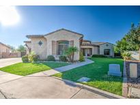 Charming single-story home featuring stucco siding, tiled roof, manicured lawn and mature landscaping at 3010 E Cedar Dr, Chandler, AZ 85249