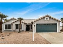 Charming single-story home with a well-kept desert landscaped front yard, and attached garage at 6303 E Preston St, Mesa, AZ 85215