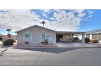 Charming single-story home with a covered carport and well-maintained landscaping in a pleasant residential area at 2550 E Ellsworth Rd # 791, Mesa, AZ 85209