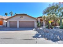 Traditional home showcasing a well-manicured yard, ample parking with a 2 car garage, and desert landscaping at 309 E Mountain Sky Ave, Phoenix, AZ 85048