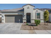 Charming single-Gathering home with a two-car garage, landscaped front yard, and covered entry at 7734 W Florence Ave, Phoenix, AZ 85043