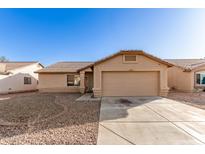 Charming single-story home featuring a two-car garage, low maintenance landscaping, and a classic Southwestern design at 10307 W Windsor Blvd, Glendale, AZ 85307